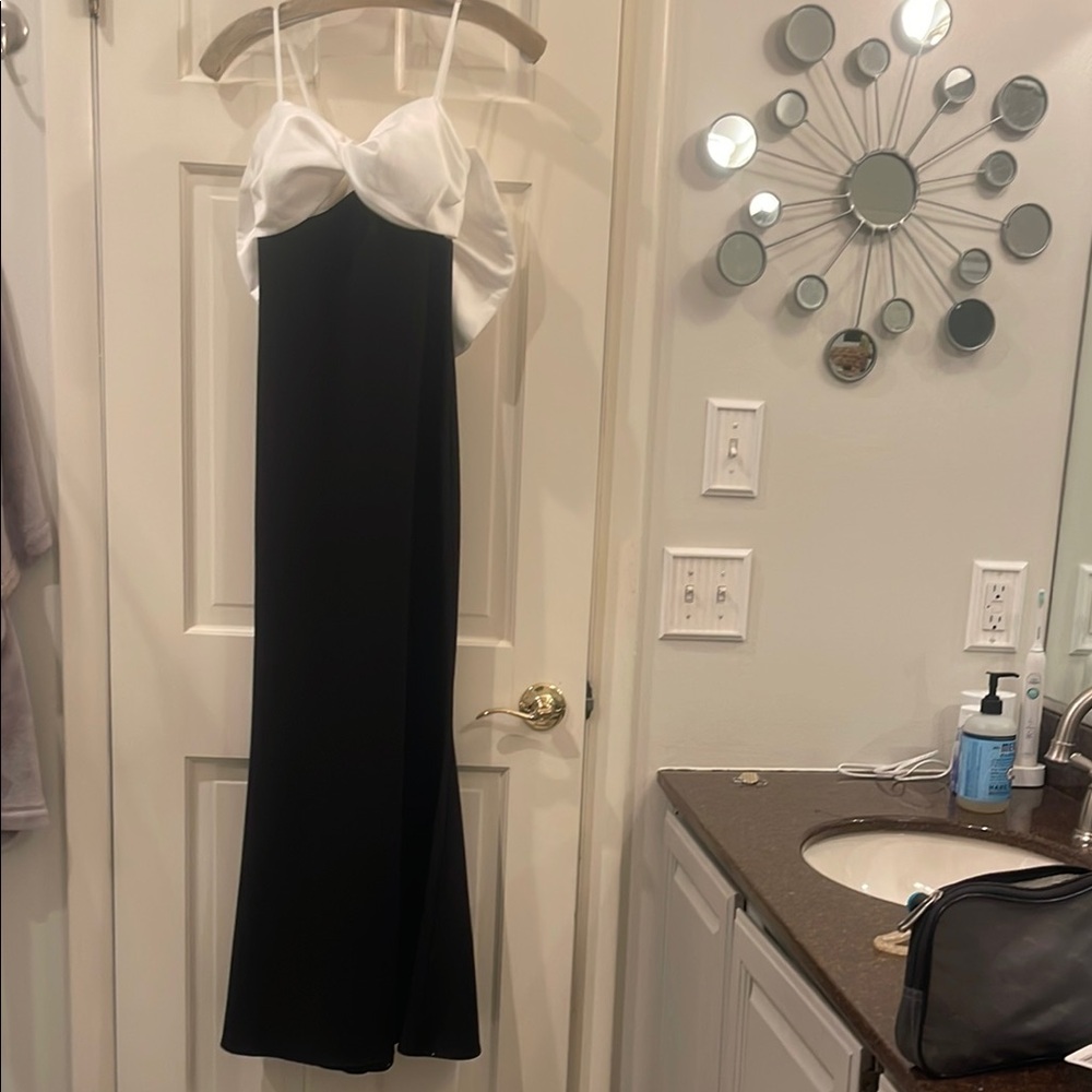 Never worn for wedding an amazing gown with full bow and train in back. Amazing